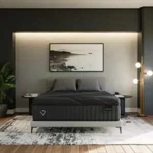 Diamond Andes mattress displayed in a modern bedroom setting with gray walls, stylish decor, and ambient lighting.