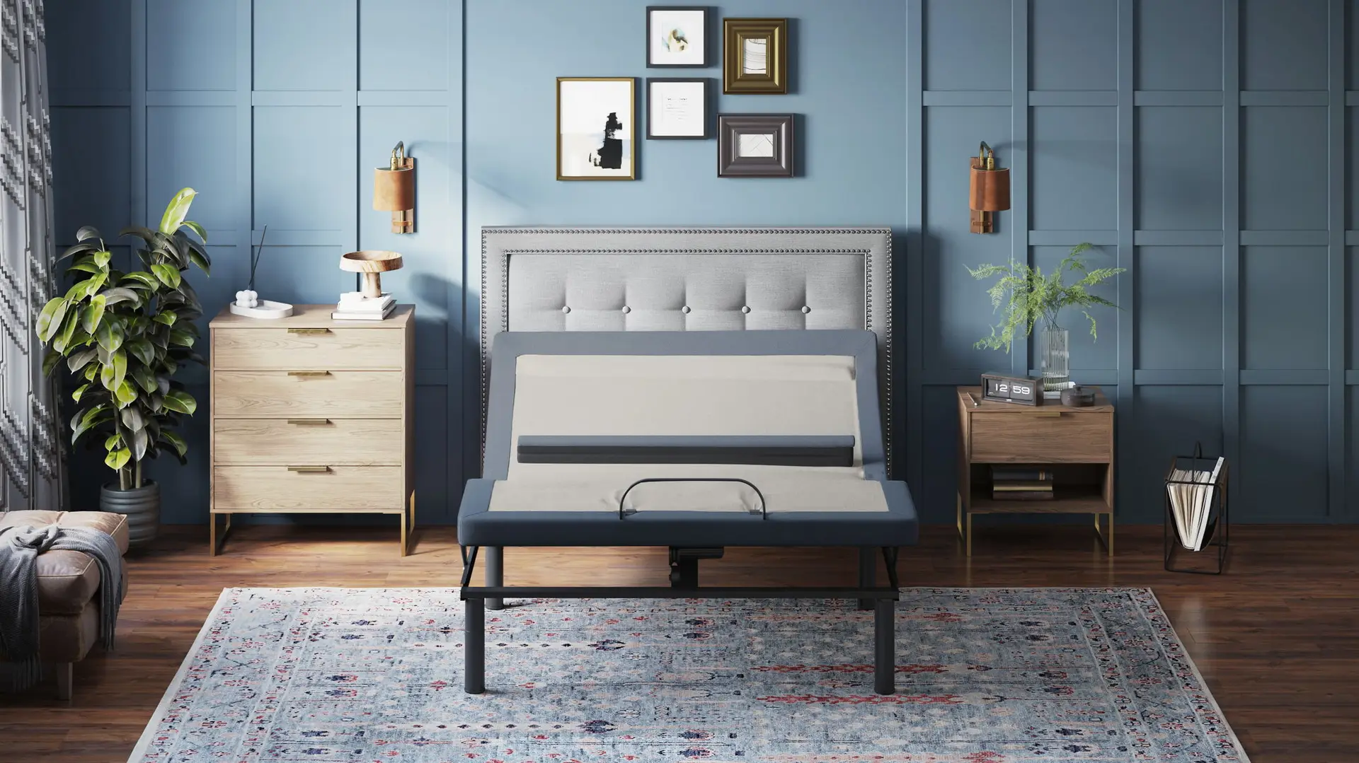 Bt6500 - Adjustable Bed Base With Head / Foot Tilt And Lumbar Position Adjustment 1 Adjustable bed base displayed in a modern bedroom setting, featuring head and foot tilt, lumbar adjustment, and a stylish gray upholstered headboard, surrounded by wooden furniture and decorative wall art.